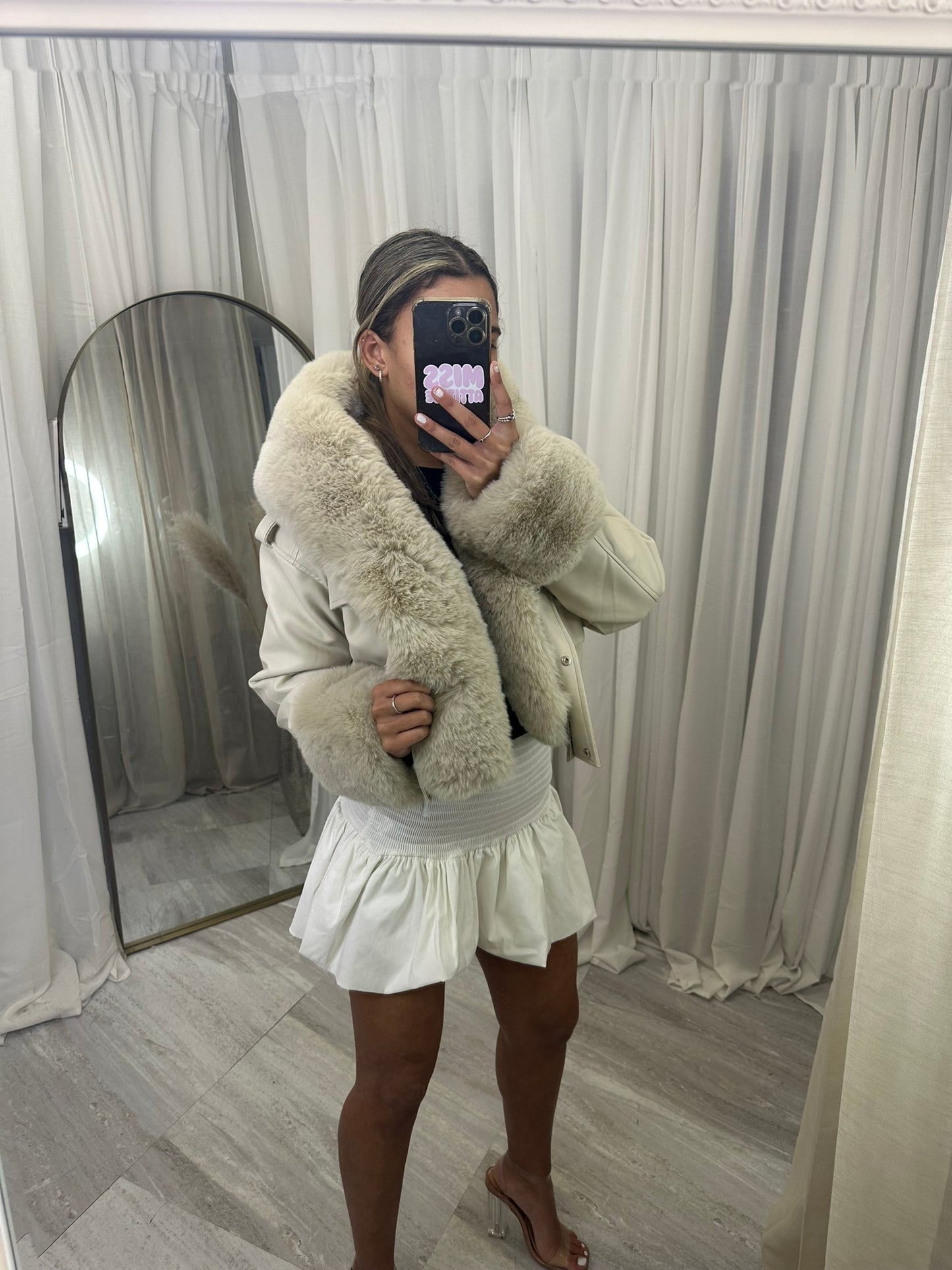Hooded faux fur jacket with fur cuffs and pockets