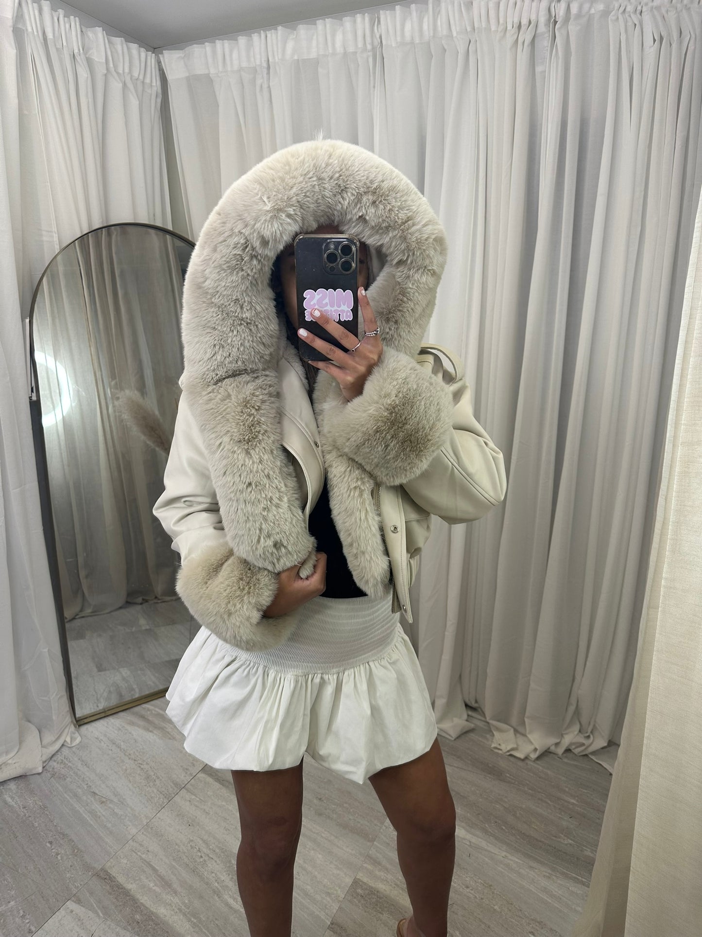 Hooded faux fur jacket with fur cuffs and pockets