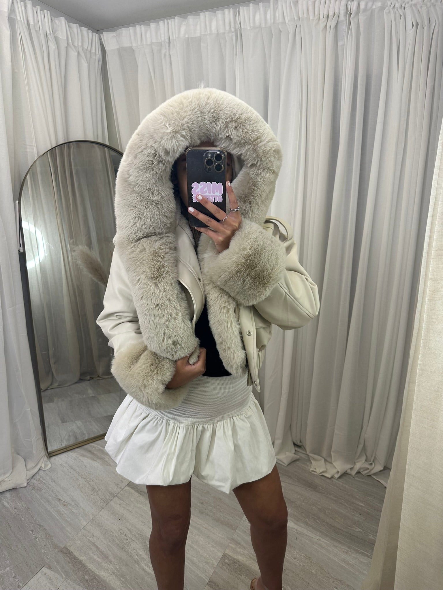 Hooded faux fur jacket with fur cuffs and pockets