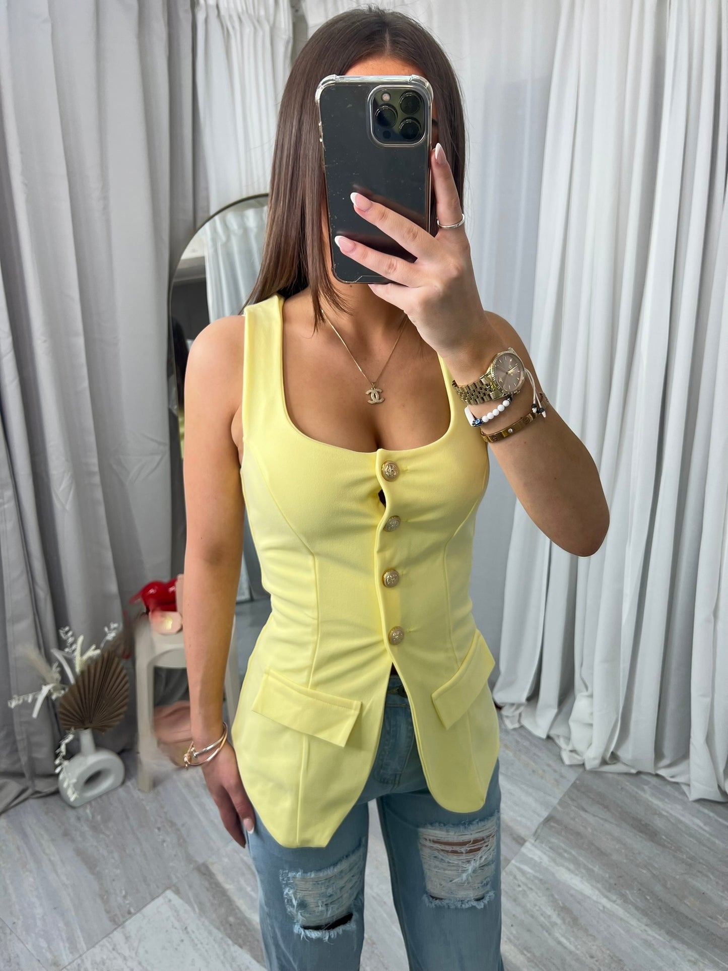 Buttoned top sleeveless waistcoat