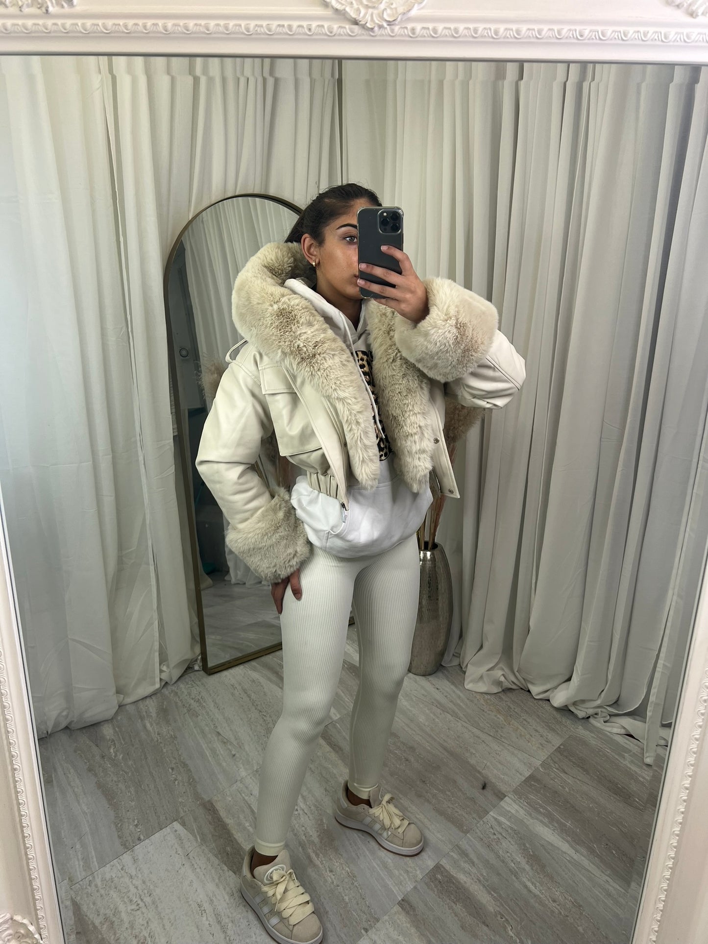 Hooded faux fur jacket with fur cuffs and pockets