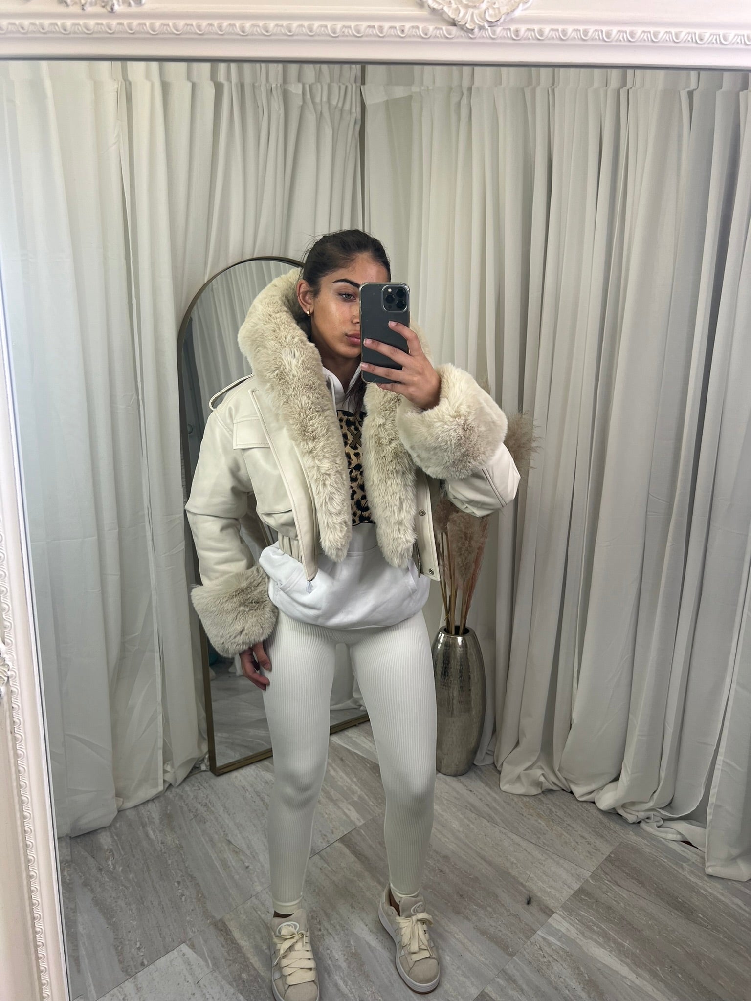 Hooded faux fur jacket with fur cuffs and pockets