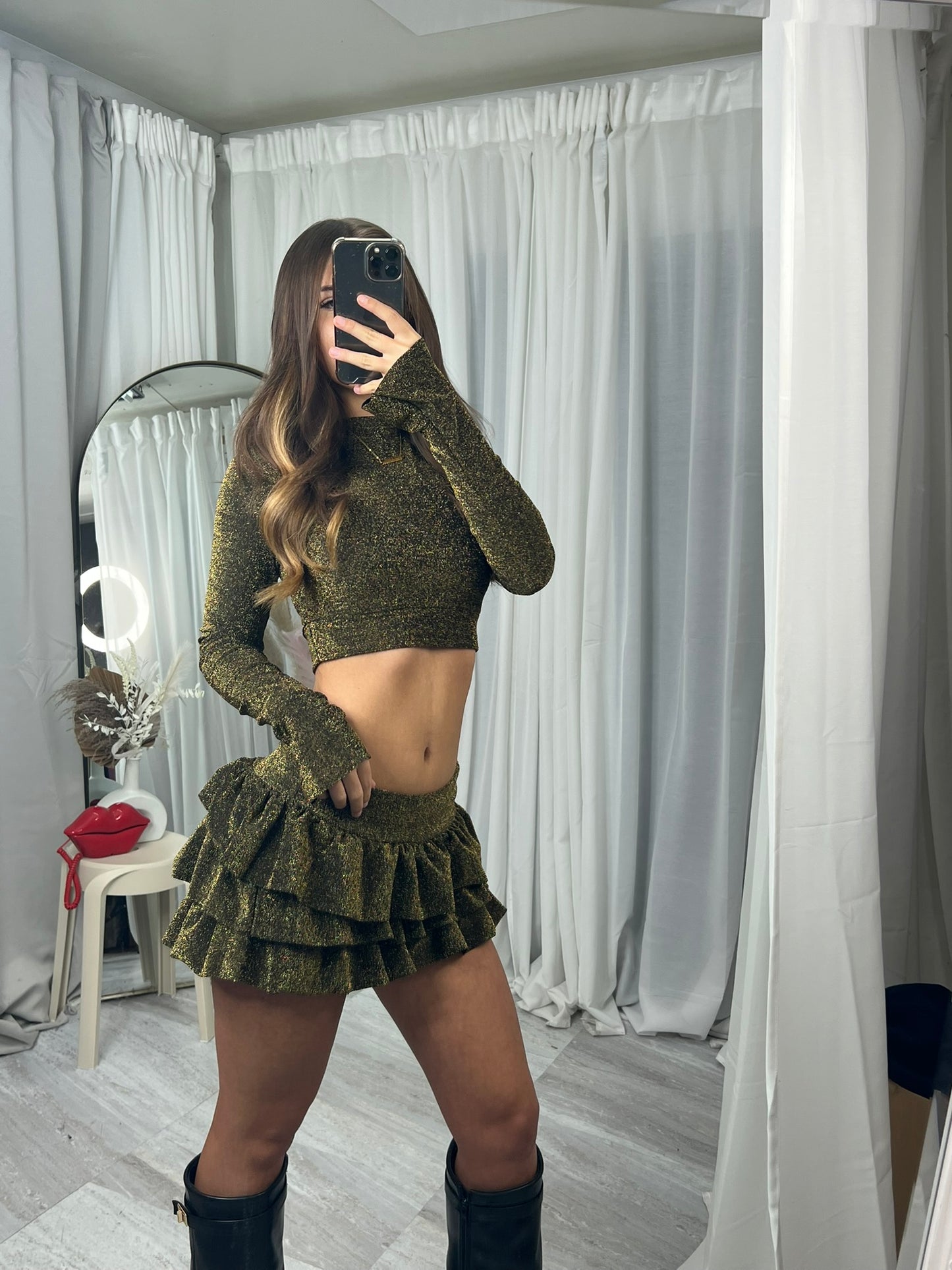 Long sleeved crop top and frill detail mini skirt party outfit