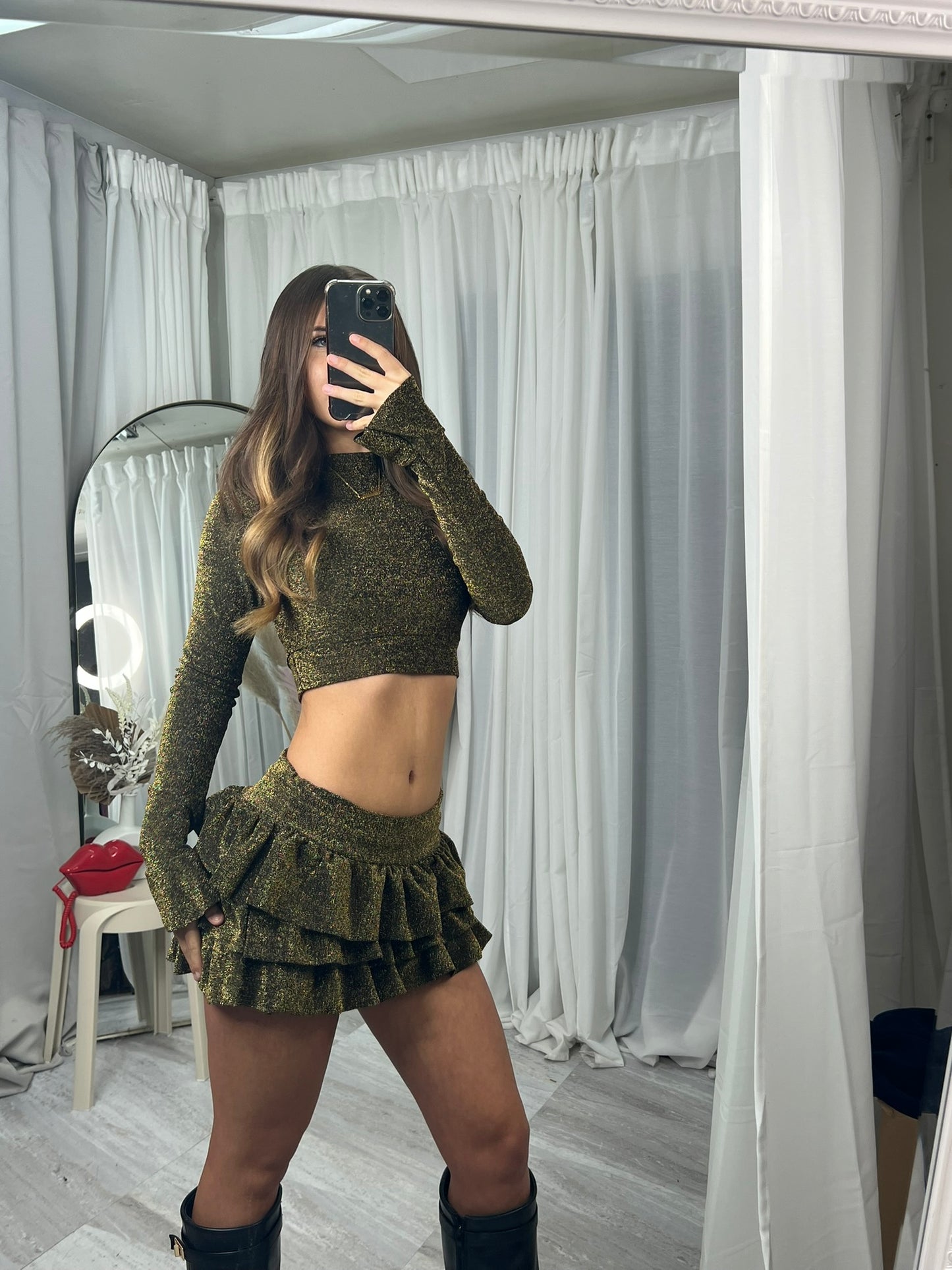 Long sleeved crop top and frill detail mini skirt party outfit