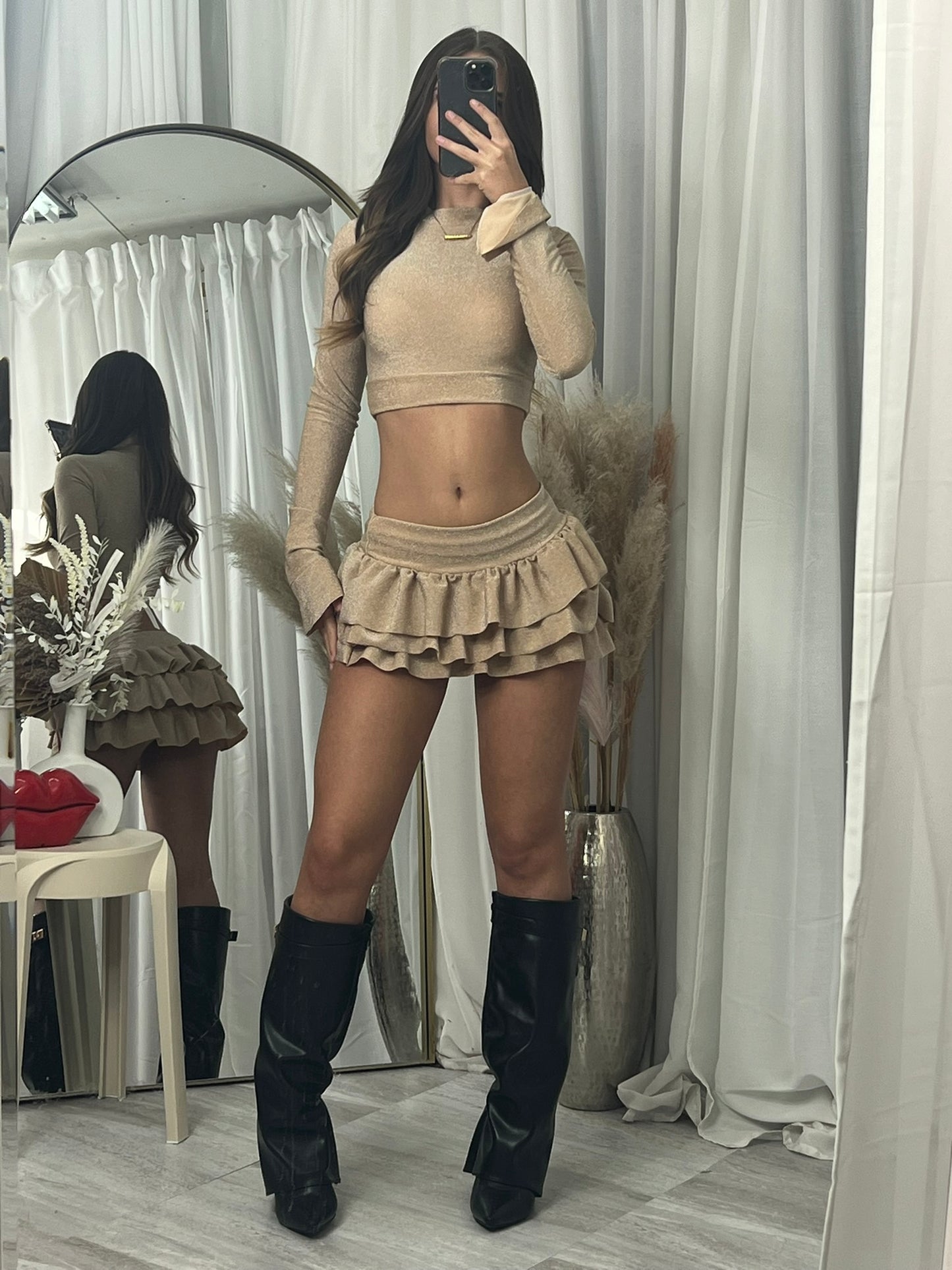 Long sleeved crop top and frill detail mini skirt party outfit