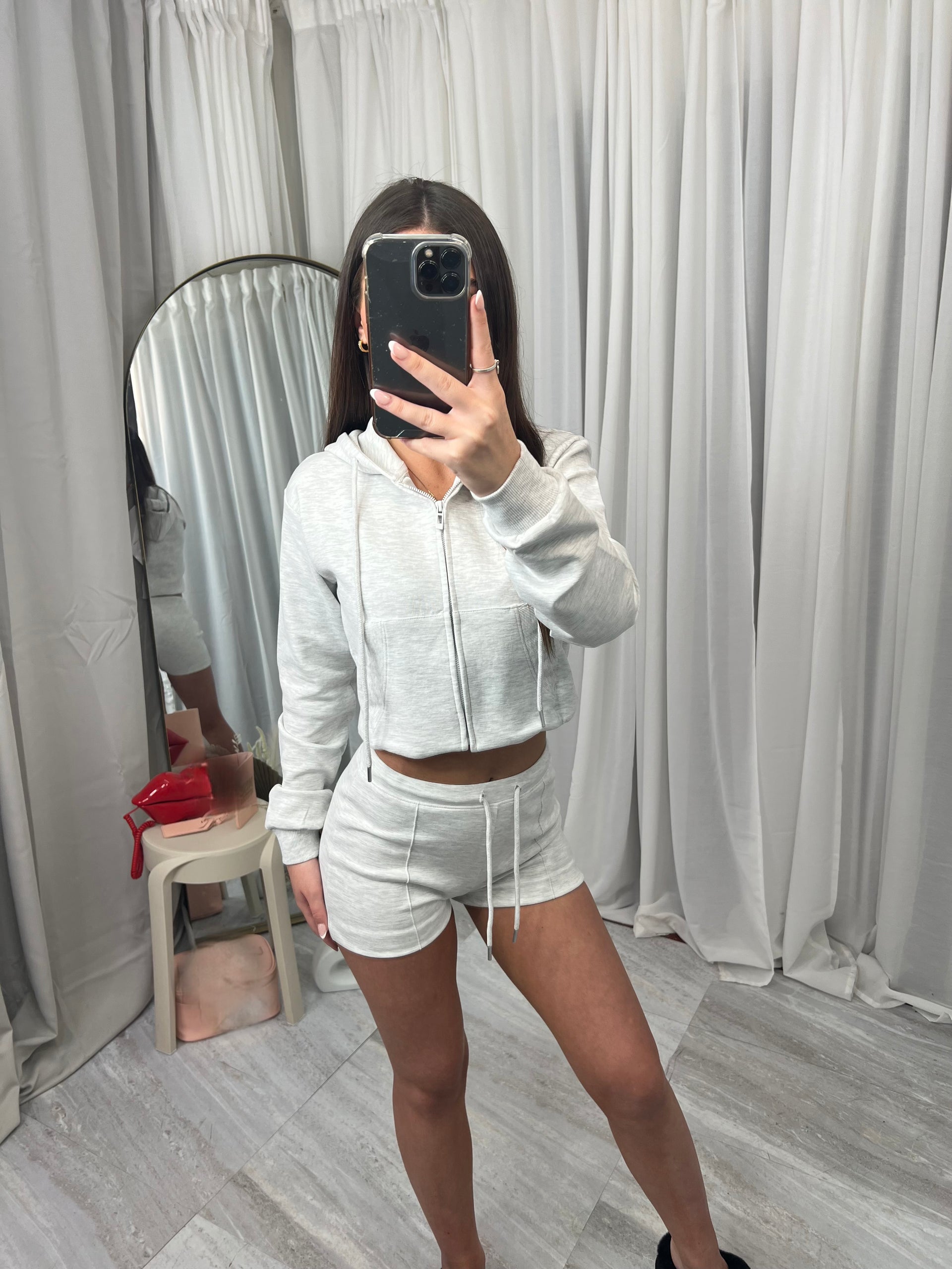 Hooded top with zip front long sleeved with drawstring shorts and elasticated waist