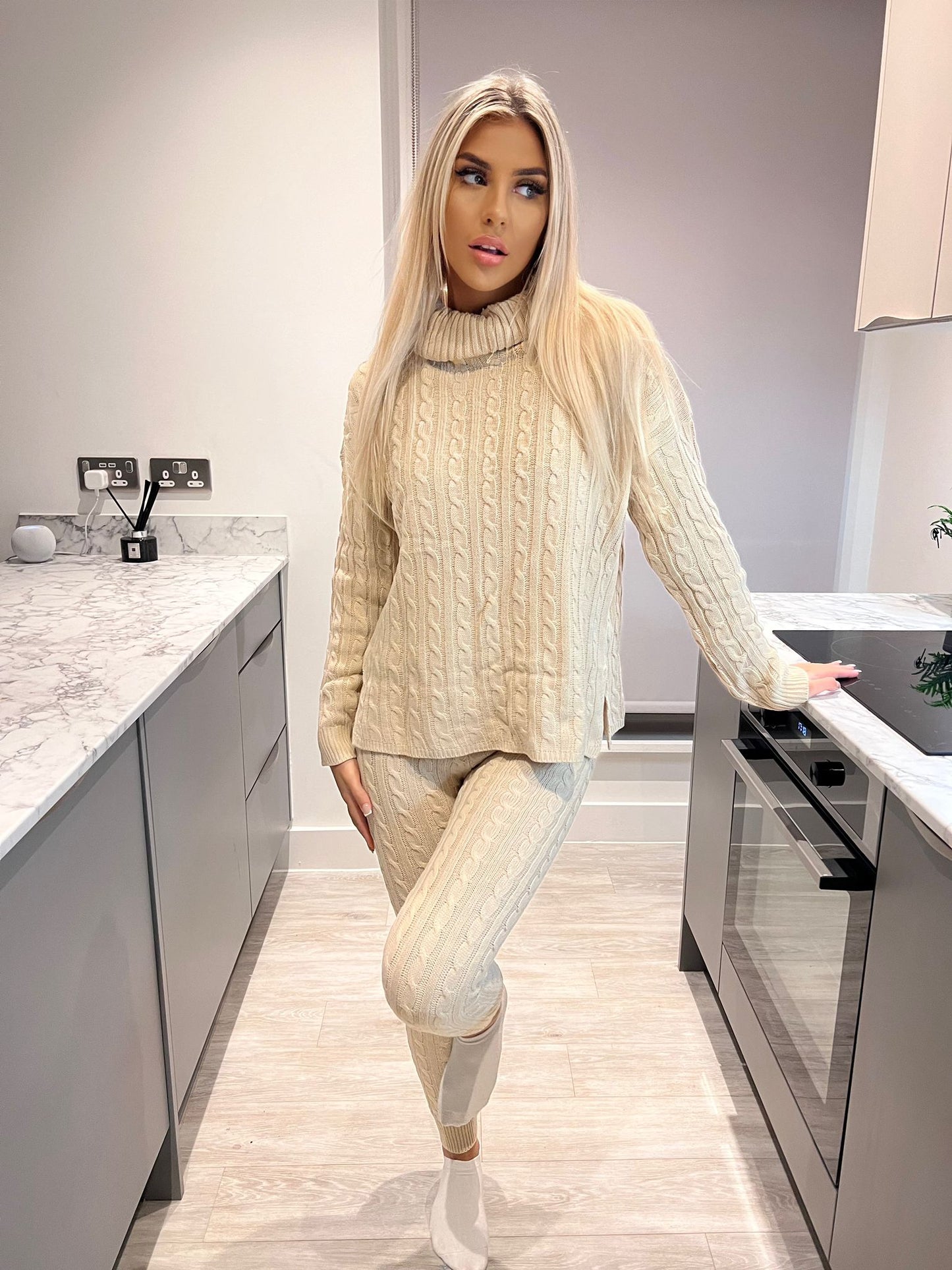 Cable knit 2 piece lounge wear roll neck set , perfect for those chilly days and nights in to wrap up with this cable knitted womans loungewear tracksuit .