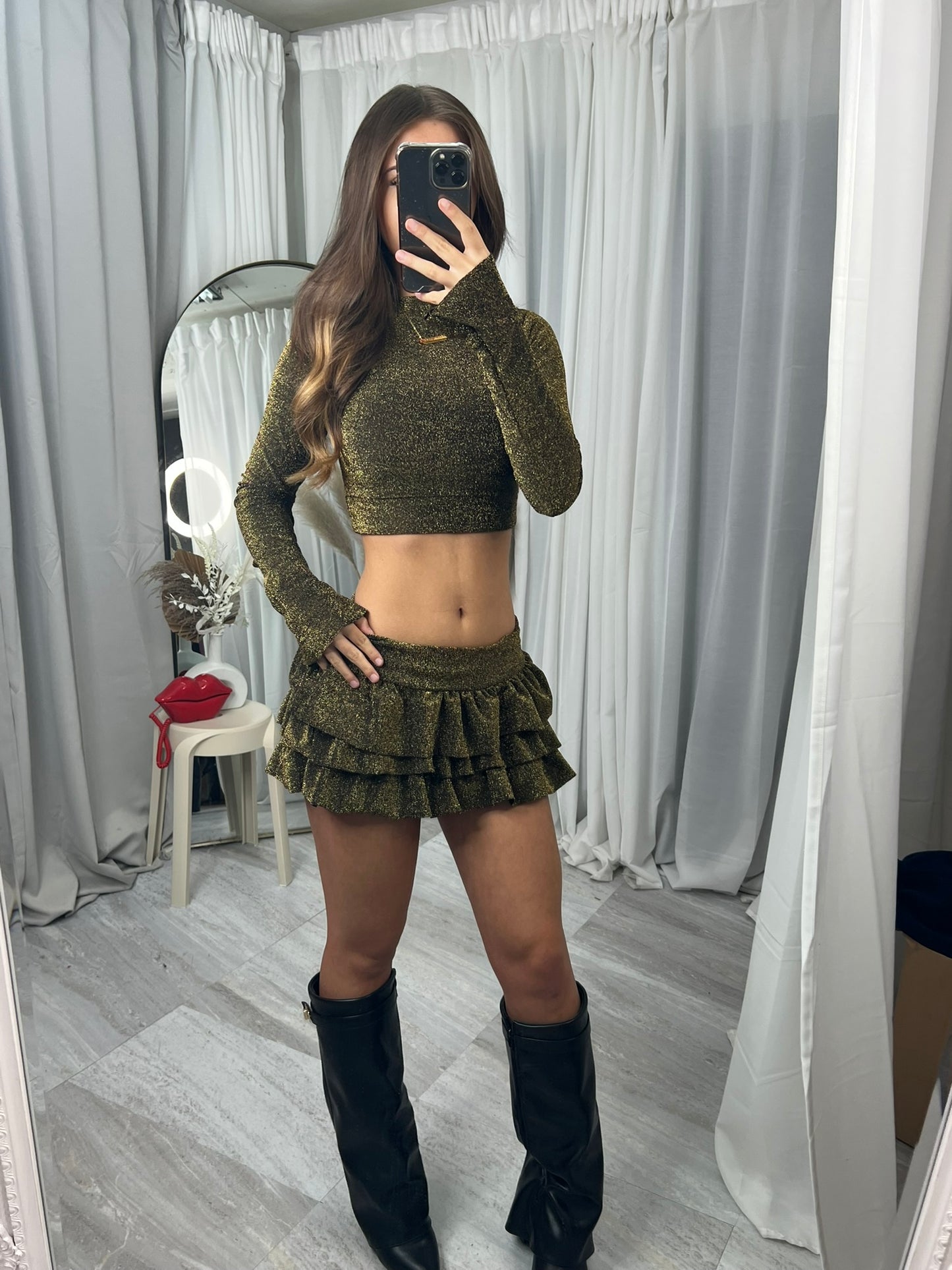 Long sleeved crop top and frill detail mini skirt party outfit