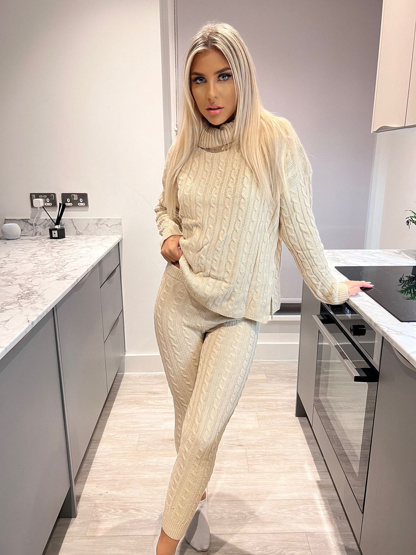 Cable knit 2 piece lounge wear roll neck set , perfect for those chilly days and nights in to wrap up with this cable knitted womans loungewear tracksuit .